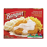 Banquet&nbsp;&nbsp;chicken fried beef steak meal covered in gravy with mashed potatoes and corn Full-Size Picture